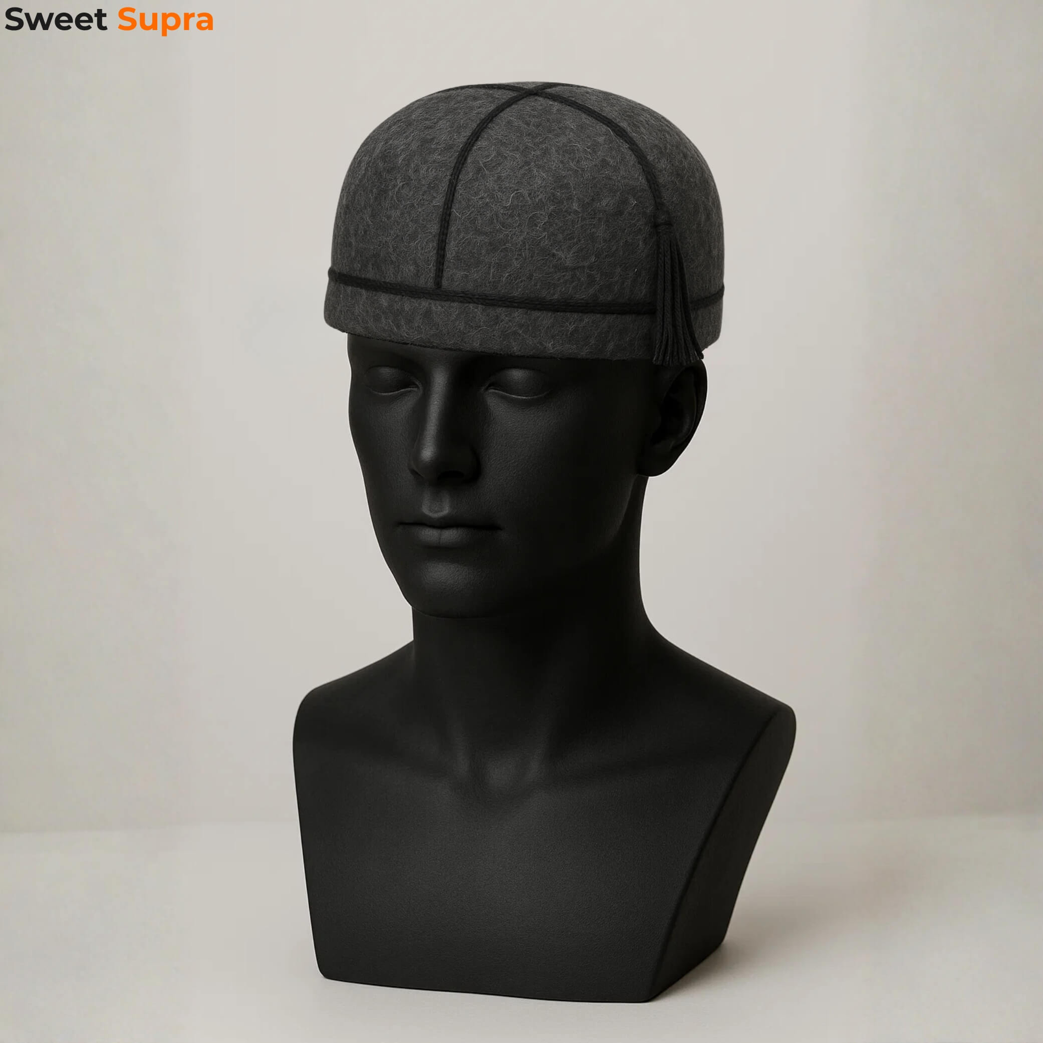 Black Georgian Svan hat on a black mannequin. Minimalist wool design with traditional panel stitching, showcasing ethnic Caucasian headwear.