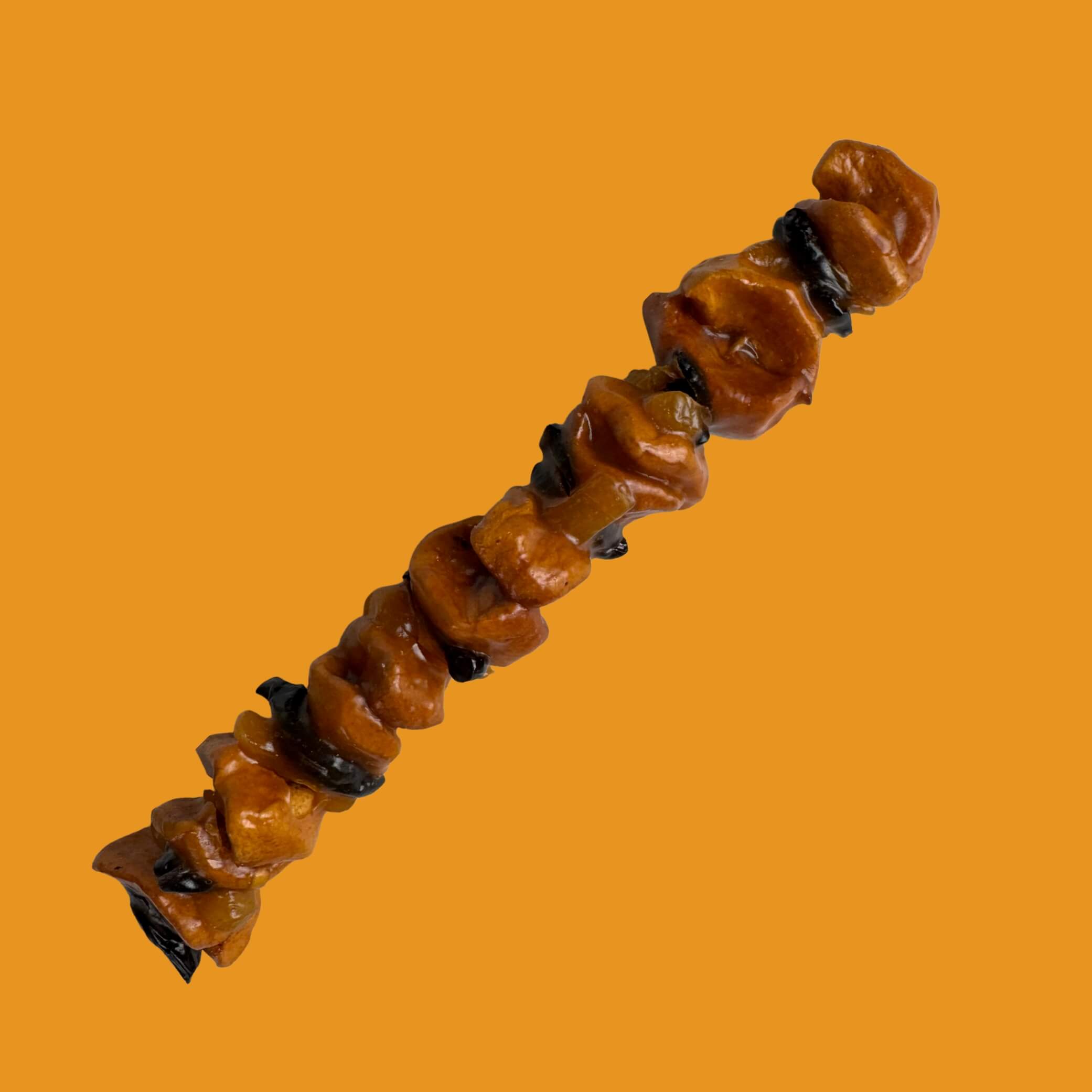 Dried fruit Georgian churchkhela with apple and plum – traditional sweet snack from Georgia.