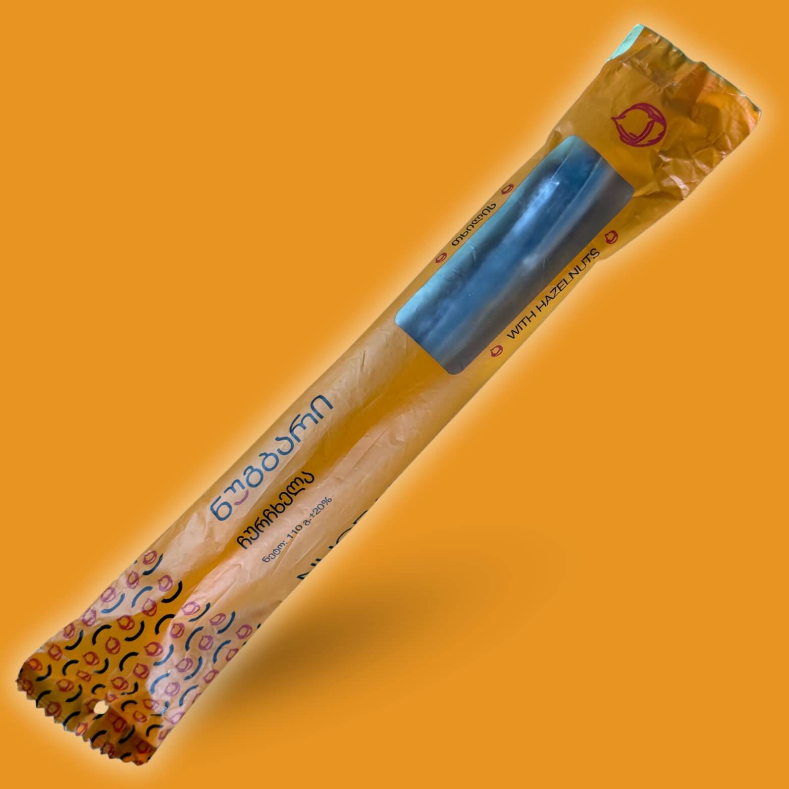 Churchkhela with hazelnuts, traditional Georgian sweet made from natural grape juice and crunchy nuts, healthy snack.